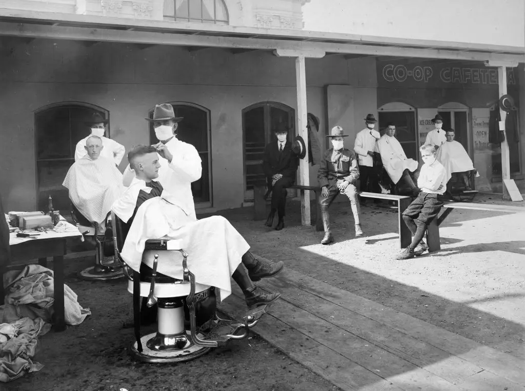 social distancing at outdoor barber shop during 1918 Spanish Flu