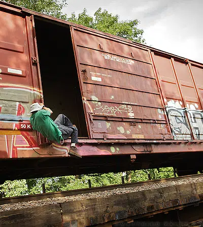 hobos, train-hoppers, travelers riding freight trains