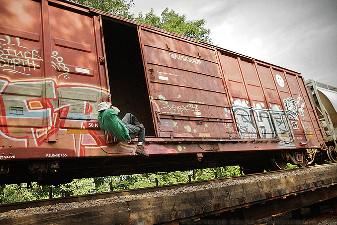 hobos, train-hoppers, travelers riding freight trains