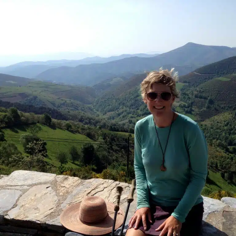 author Dee Andrews at the Monte O Cebreiro on the Camino Frances, hiking her own hike